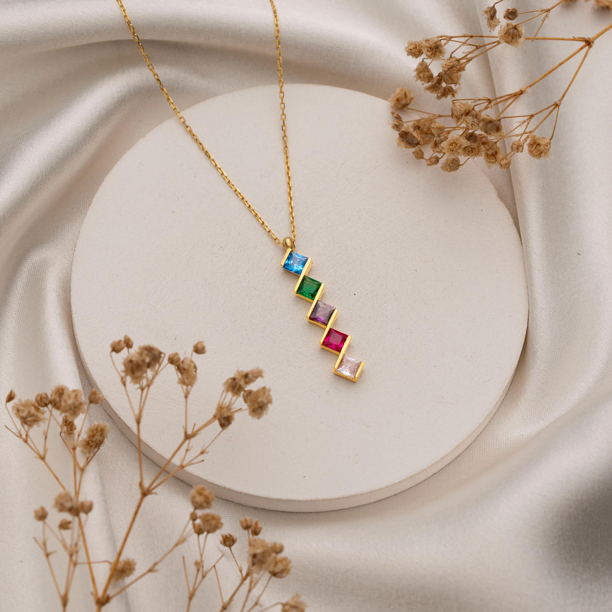 Custom square birthstone necklace styled as a gift