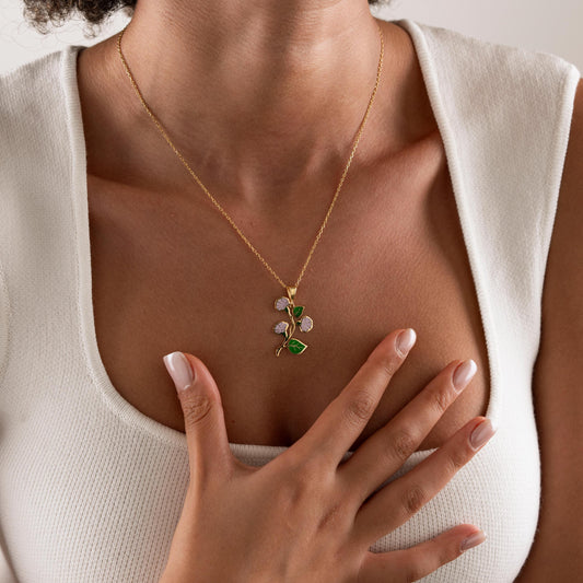 Enamel flower charm worn on the neck