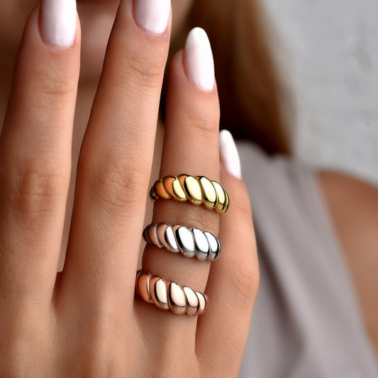 Twisted croissant ring styled on the hand