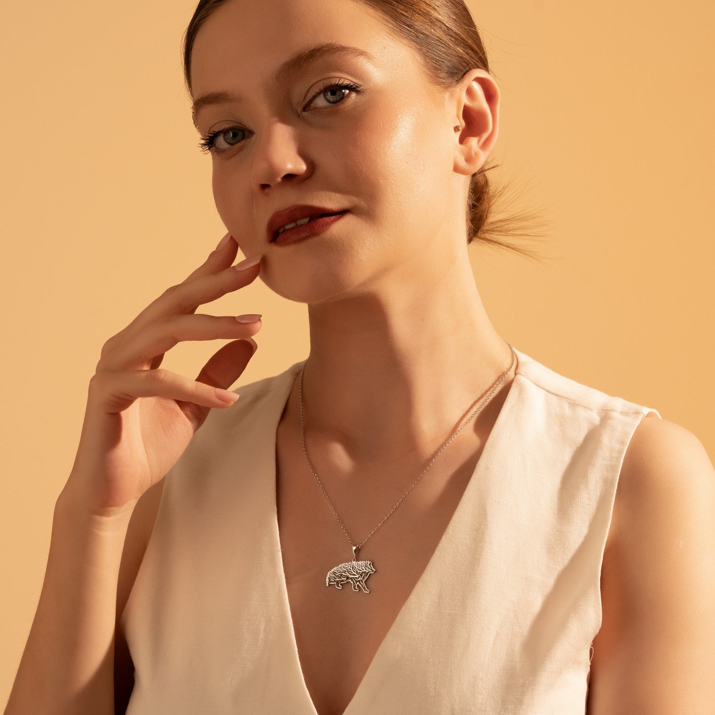 Nature-inspired wild boar necklace styled for everyday wear