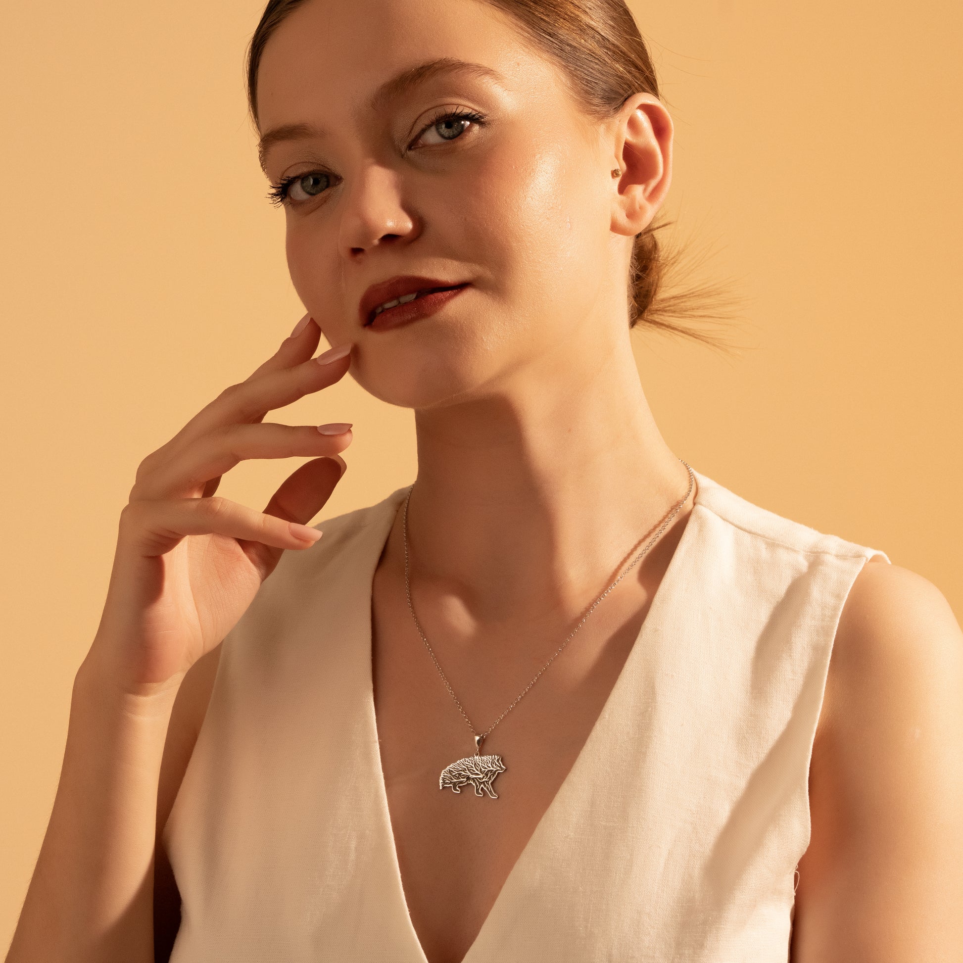 Nature-inspired wild boar necklace styled for everyday wear