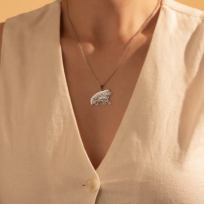 Silver Tree of Life wild boar necklace worn by a woman