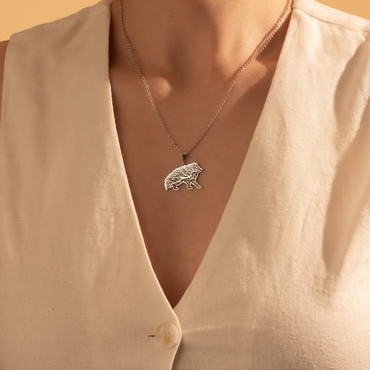 Silver Tree of Life wild boar necklace worn by a woman