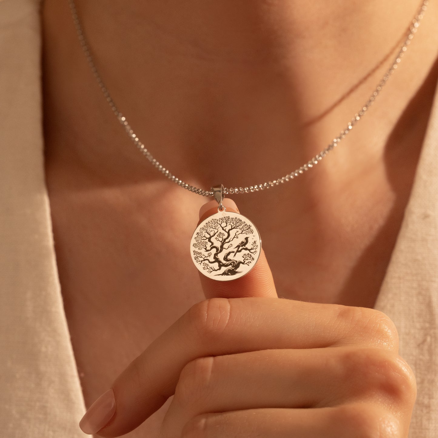 Detailed silver Tree of Life coin pendant close-up