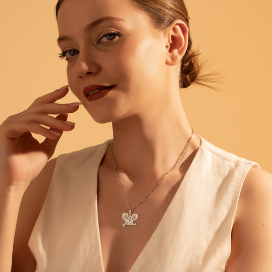 Silver Tree of Life eagle pendant necklace worn by a woman