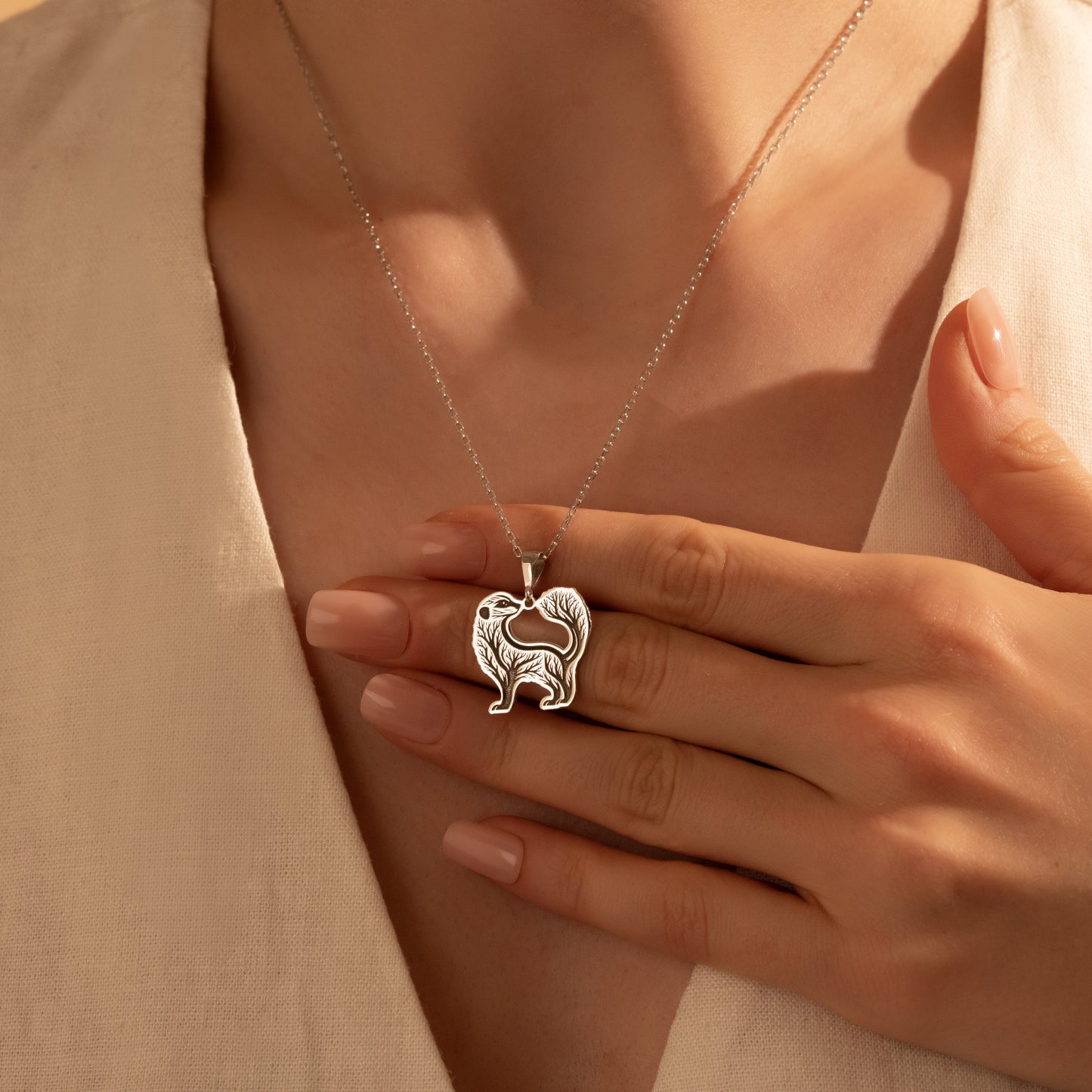 Nature-inspired badger necklace worn by a woman