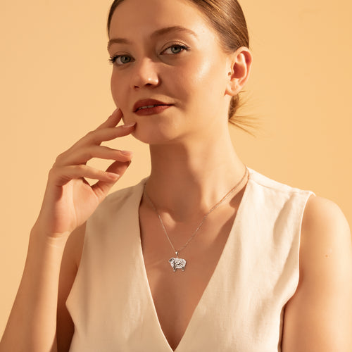 Silver Tree of Life sheep pendant necklace worn by a woman
