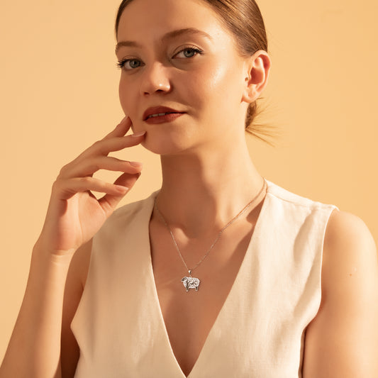 Silver Tree of Life sheep pendant necklace worn by a woman