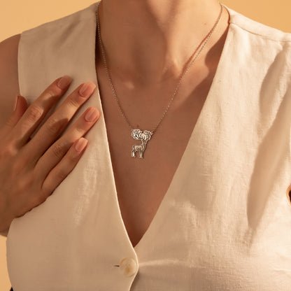 Nature-inspired silver deer and antler pendant necklace