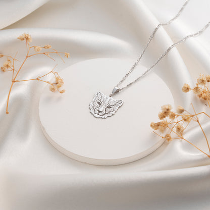 Silver fox pendant necklace with intricate leaf detailing