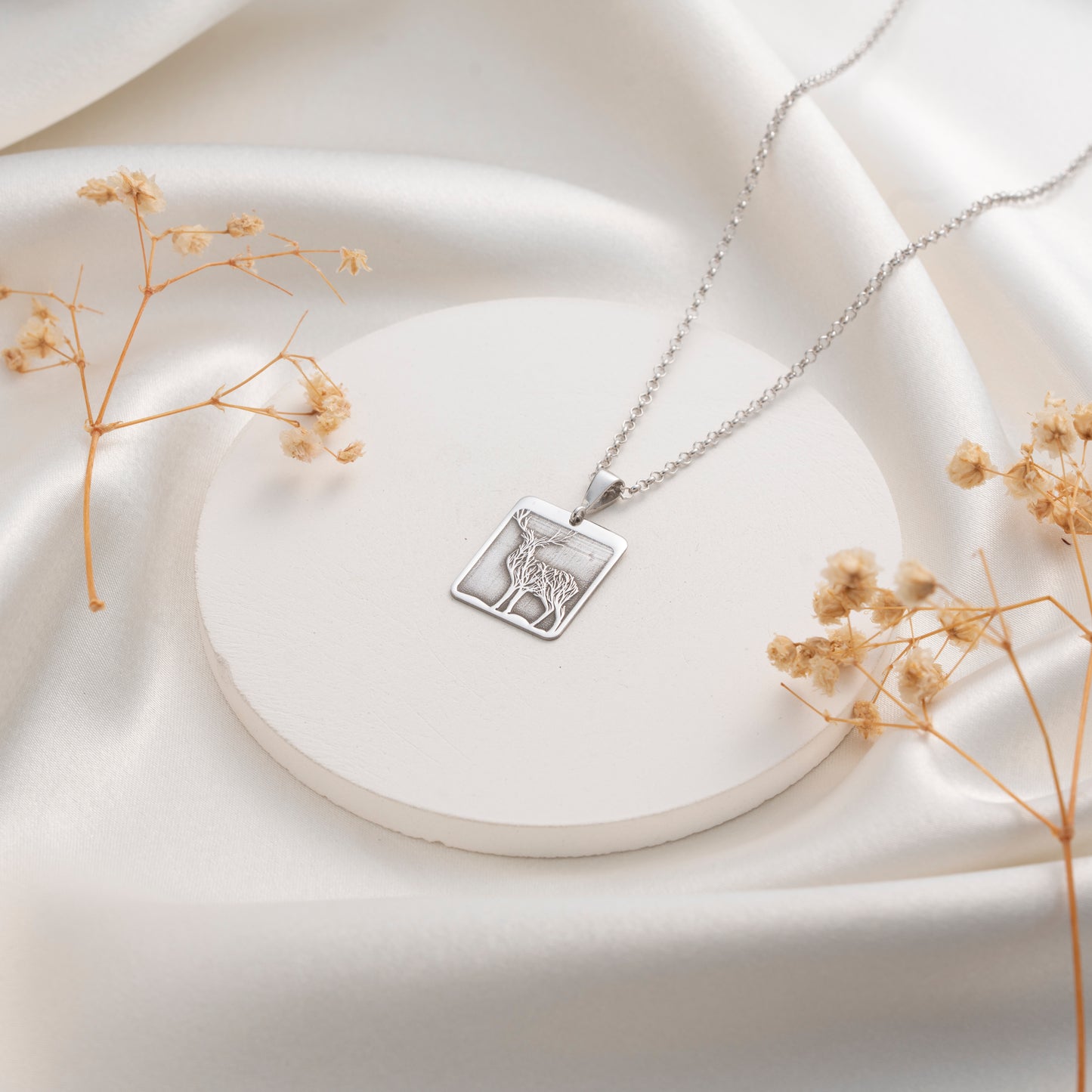 Silver deer necklace with rectangular open frame