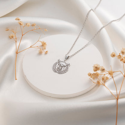 Intricate deer and botanical medallion pendant