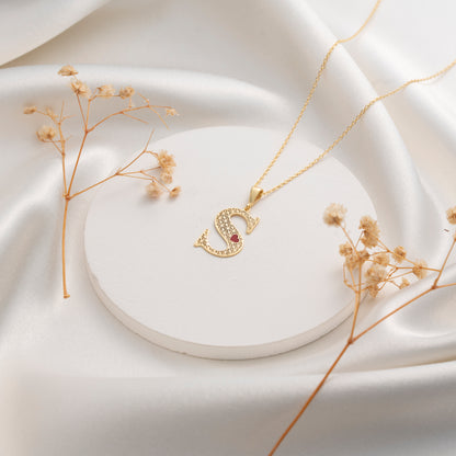 Gold filigree letter S pendant necklace with stone accent