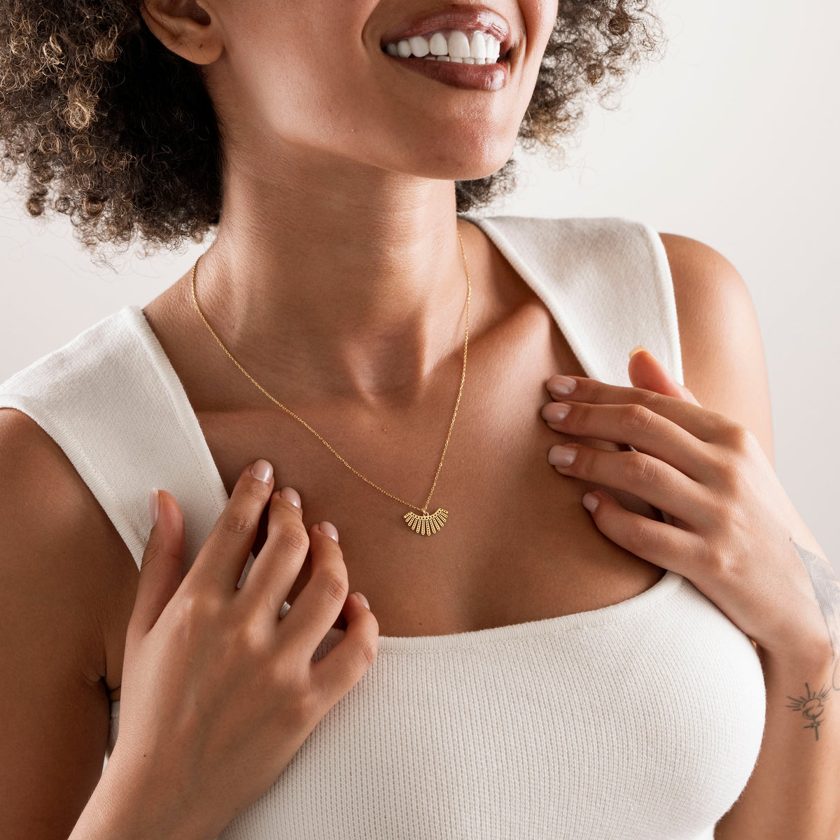 Sunburst necklace in plain 925 sterling silver on a neutral background