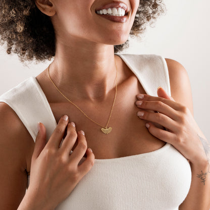 Sunburst necklace in plain 925 sterling silver on a neutral background