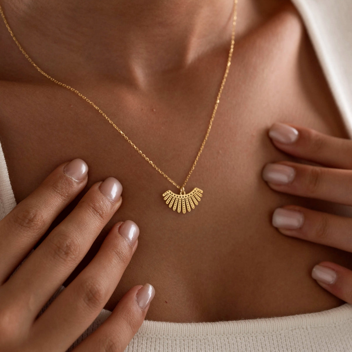 Fan pendant necklace flat lay with the delicate chain and clasp