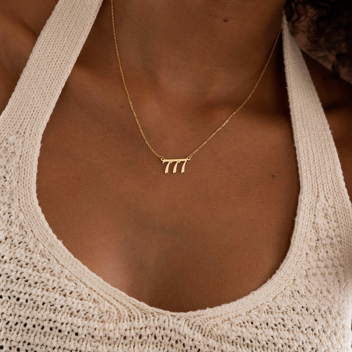 555 Angel Number necklace pendant close-up