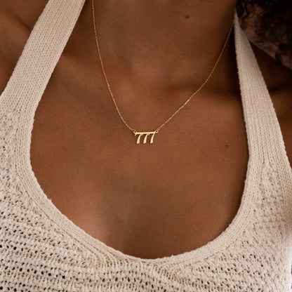 555 Angel Number necklace pendant close-up