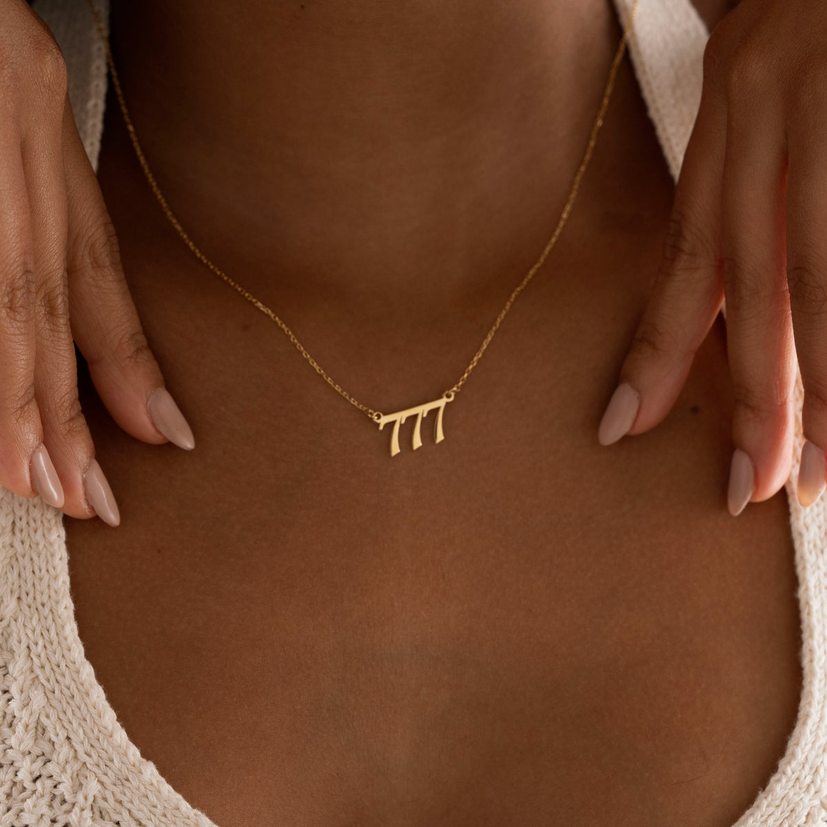 Meaningful numerology necklace worn by model