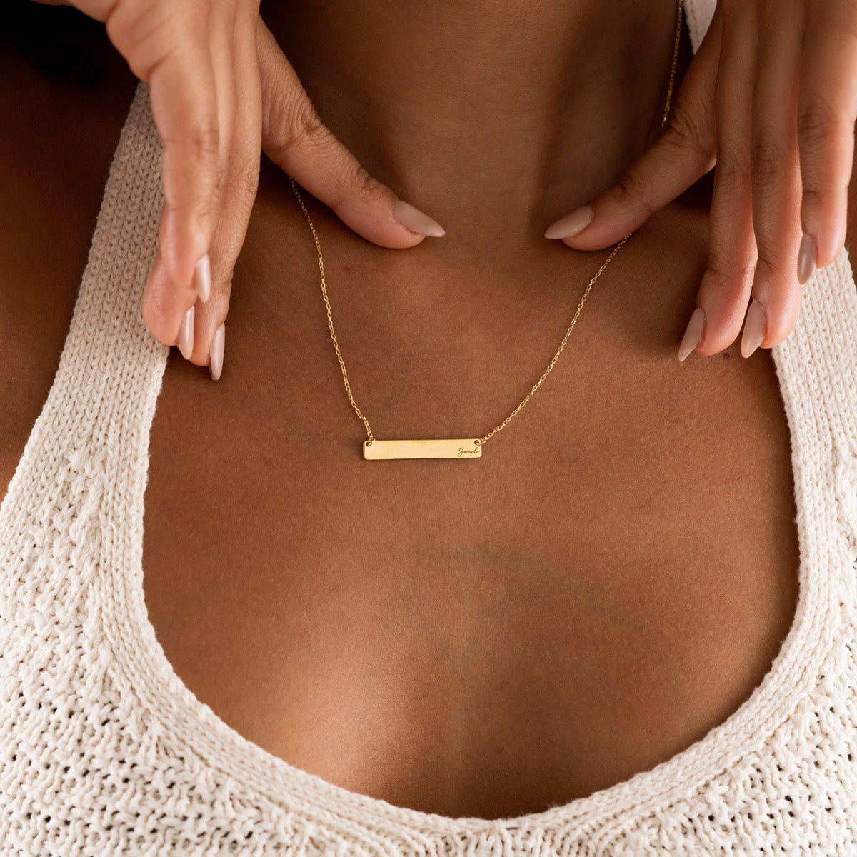 Gold engraved bar necklace shown from the front