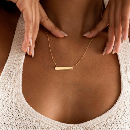Gold engraved bar necklace shown from the front