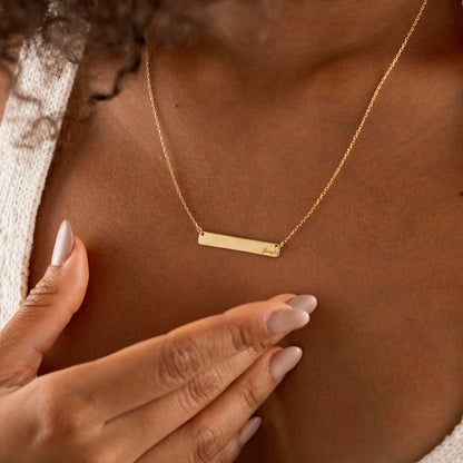 Gold rectangular bar pendant with custom engraving