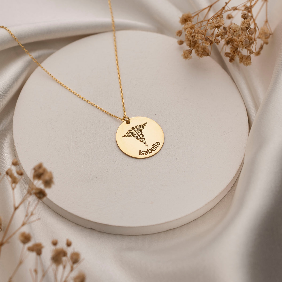Round Caduceus pendant engraved with a custom name