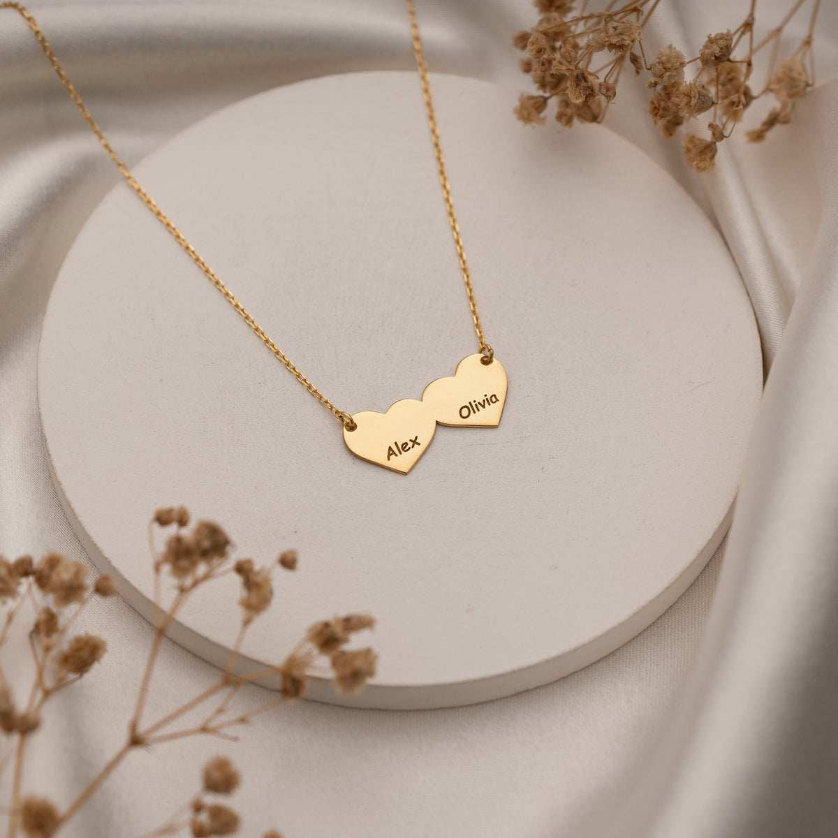 Personalized two name heart necklace worn by model