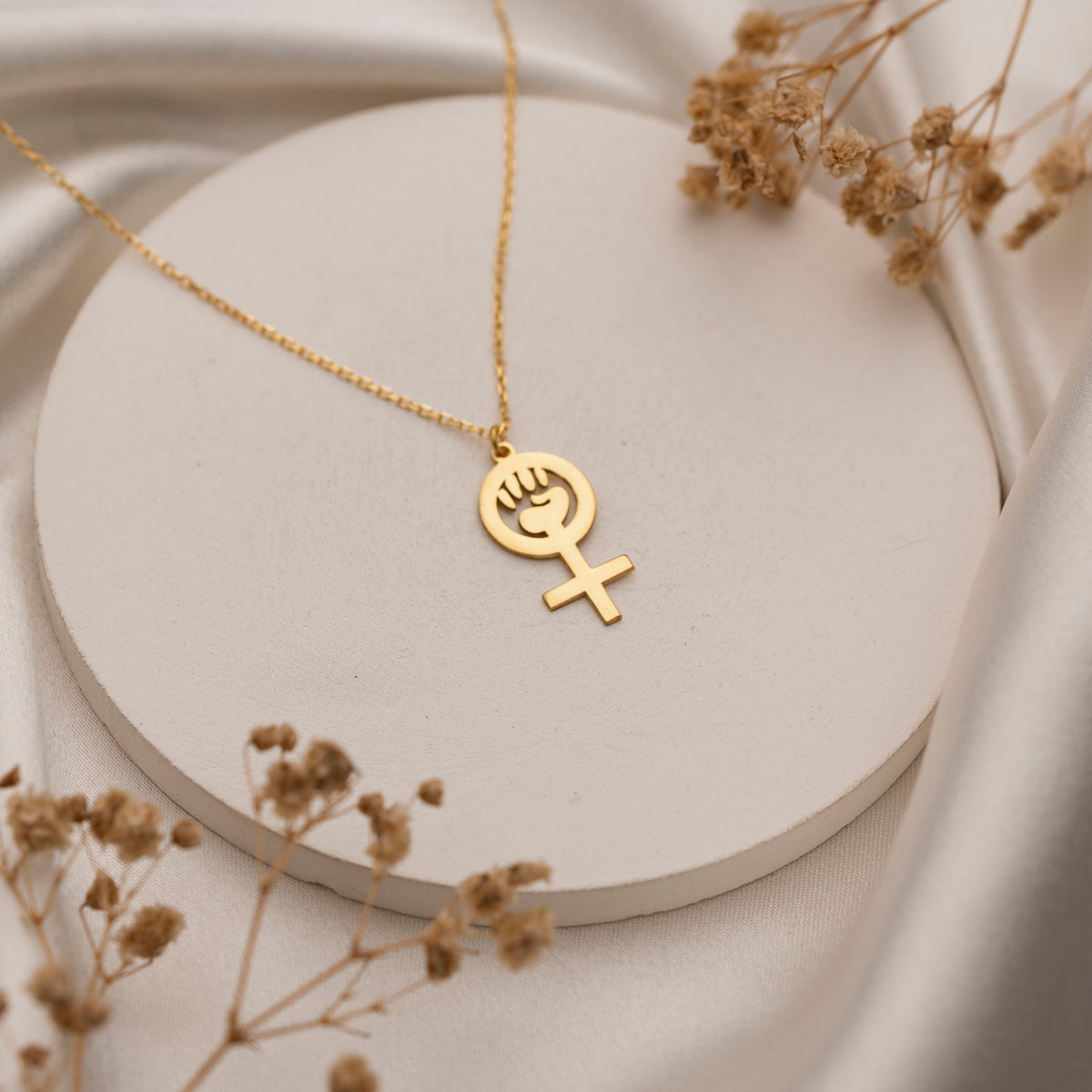 Venus symbol necklace styled for everyday wear