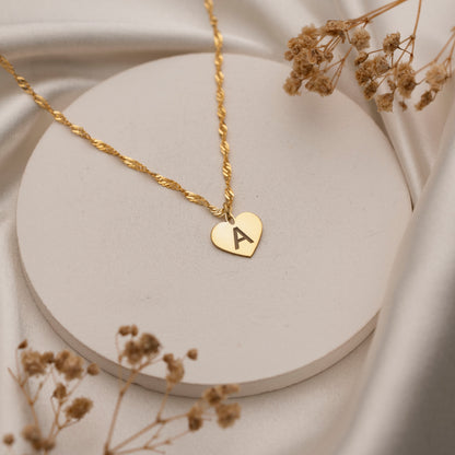 Heart initial necklace styled for everyday wear