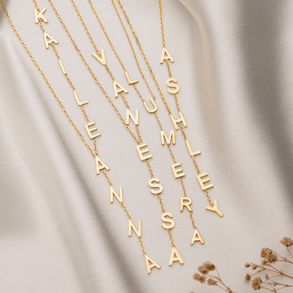 Custom letter necklace pendant arrangement close-up