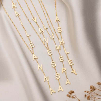 Custom letter necklace pendant arrangement close-up