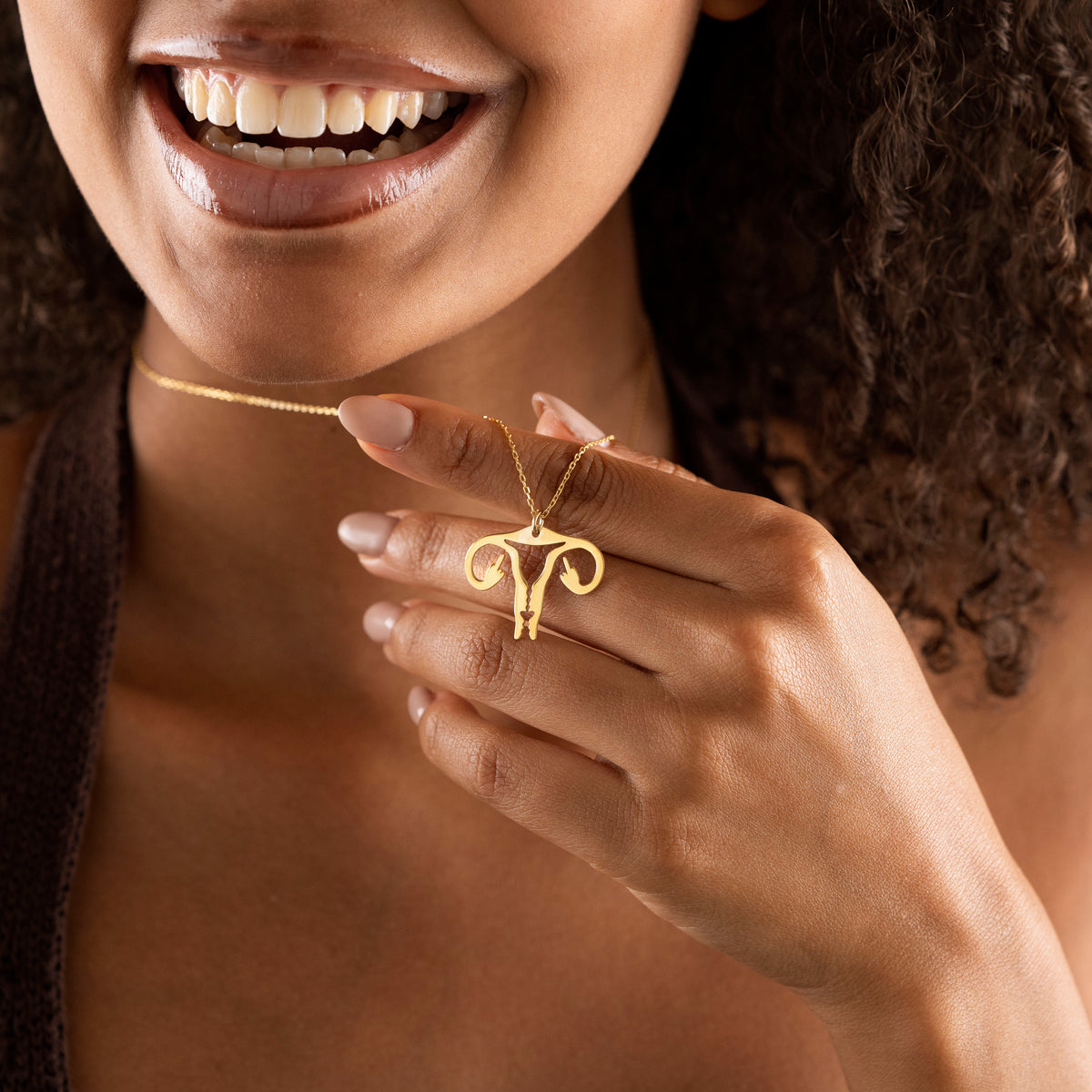 Close-up of anatomical uterus pendant jewelry