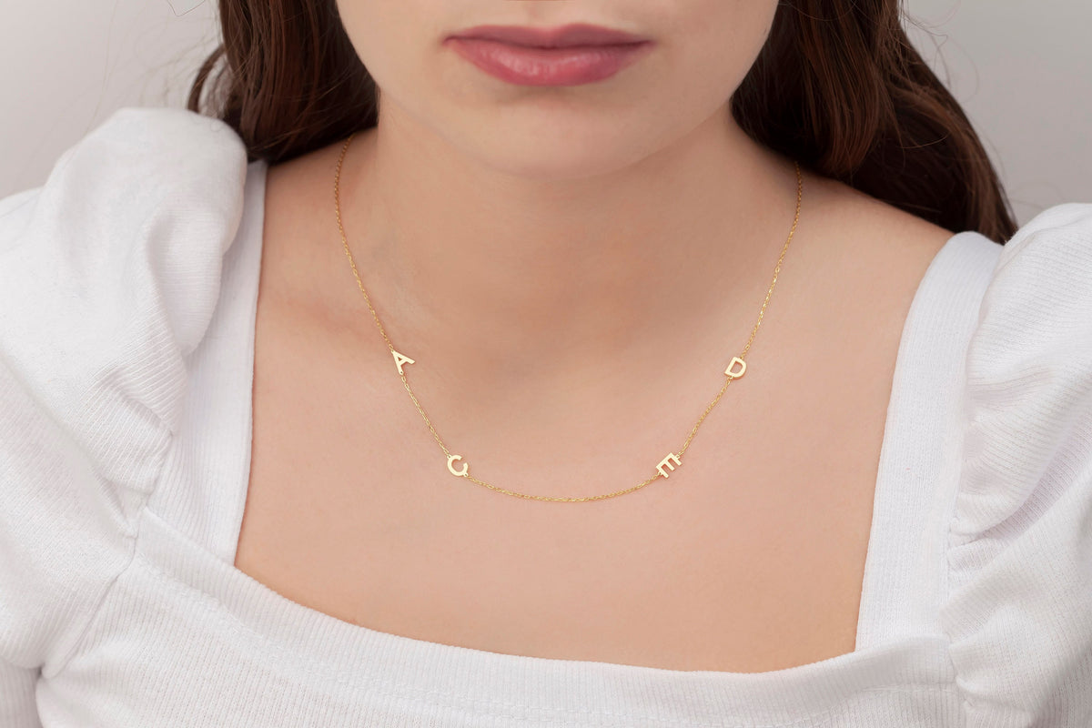 Personalized sideways letter necklace close up