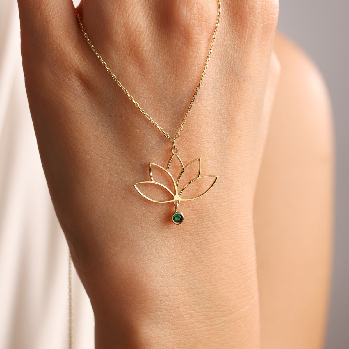 Lotus flower birthstone pendant close up