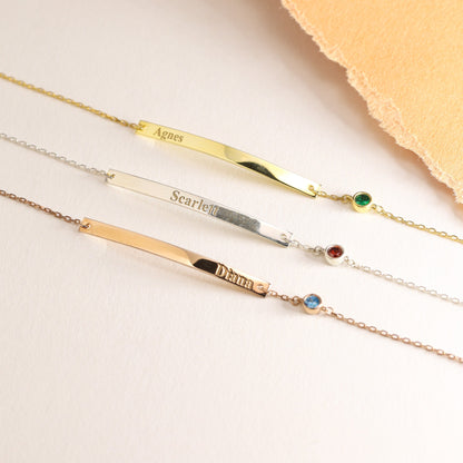 Engraved bar bracelets laid flat in several finishes