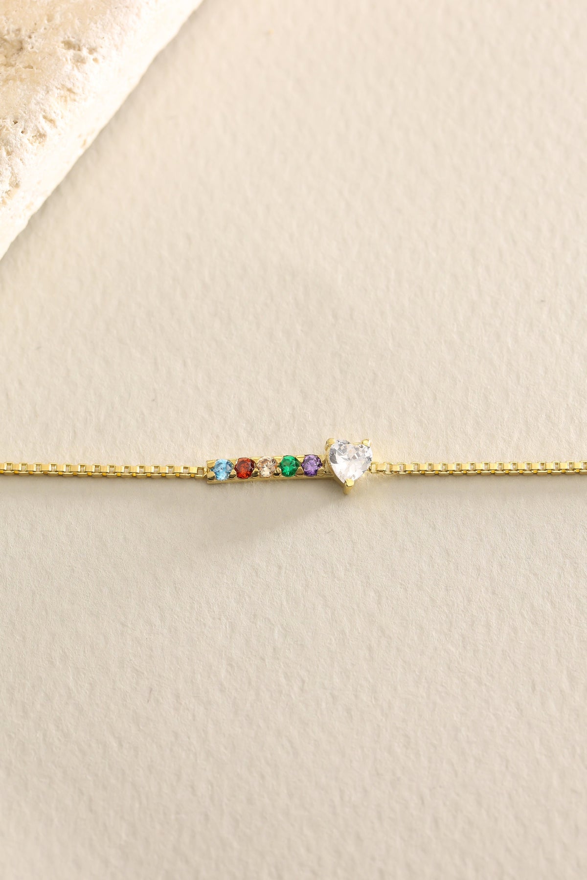 Birthstone bracelets laid flat showing multiple stones