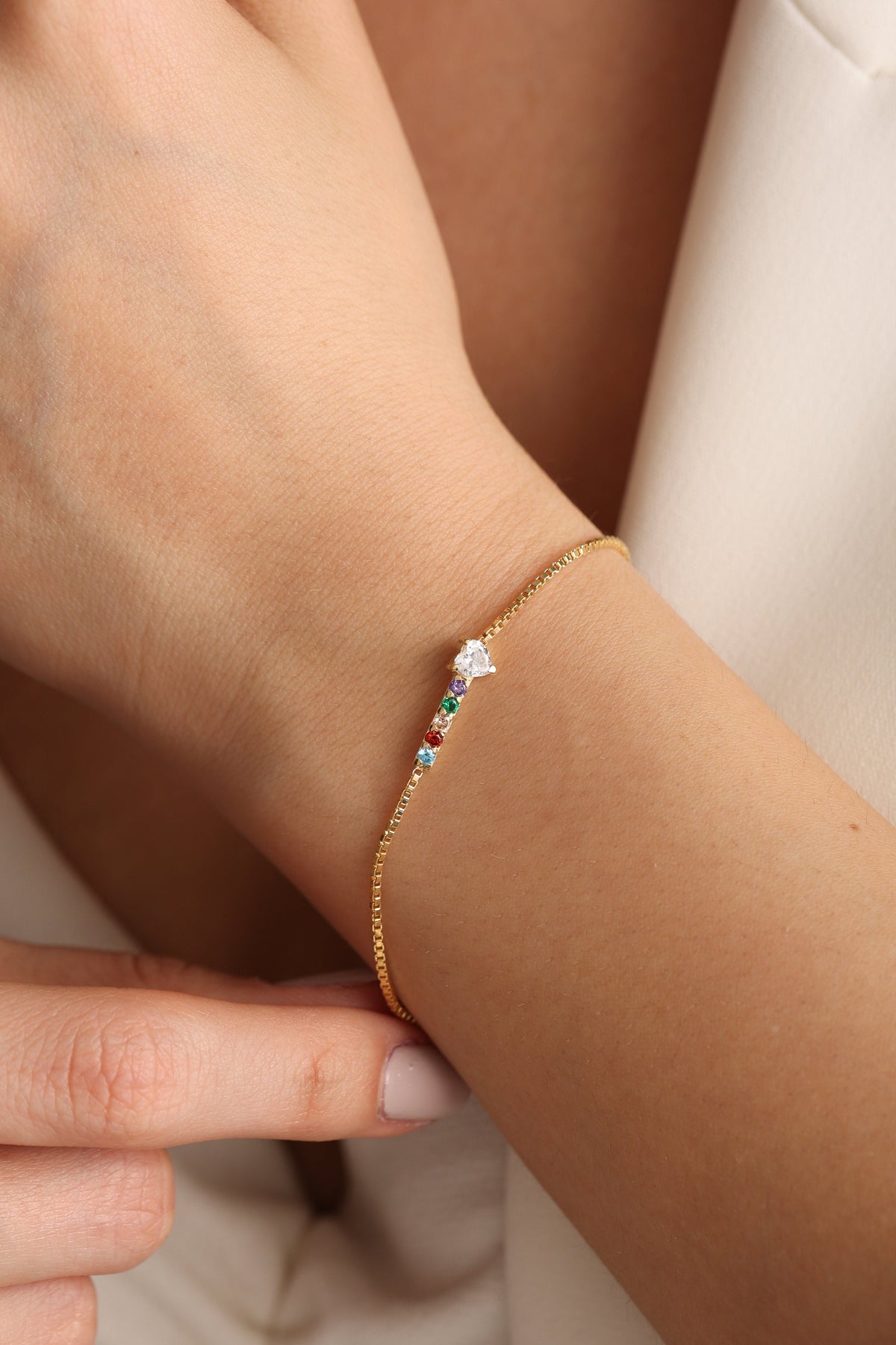 Custom gemstone family bracelet on the arm