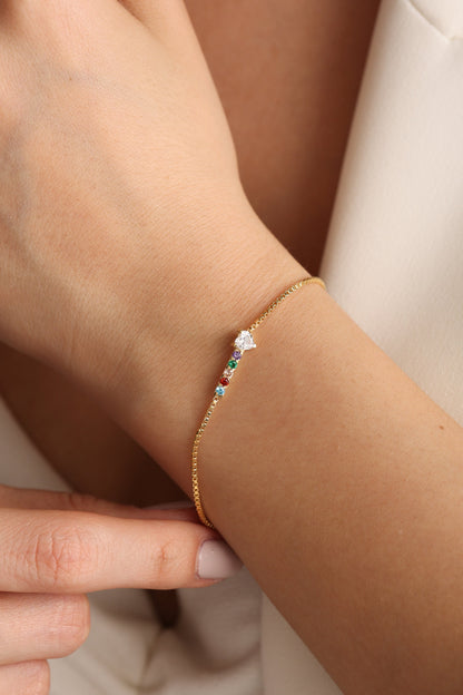 Custom gemstone family bracelet on the arm