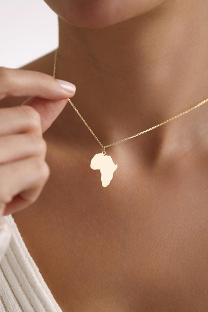 Africa continent pendant held in hand