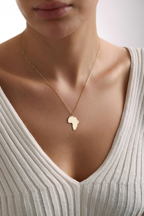 Africa map necklace in gold worn on the neck