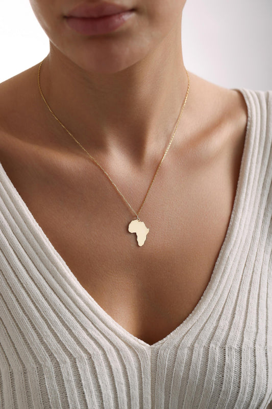 Africa map necklace in gold worn on the neck