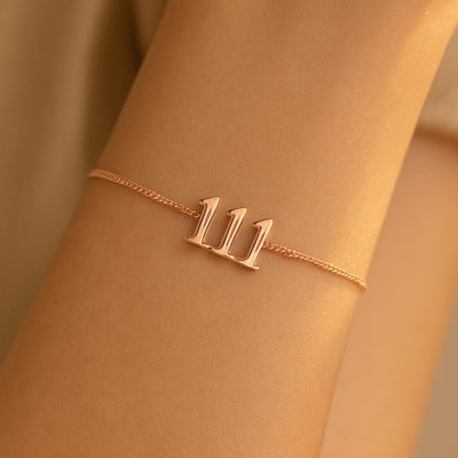 Bubble digit angel number bracelet worn on the wrist