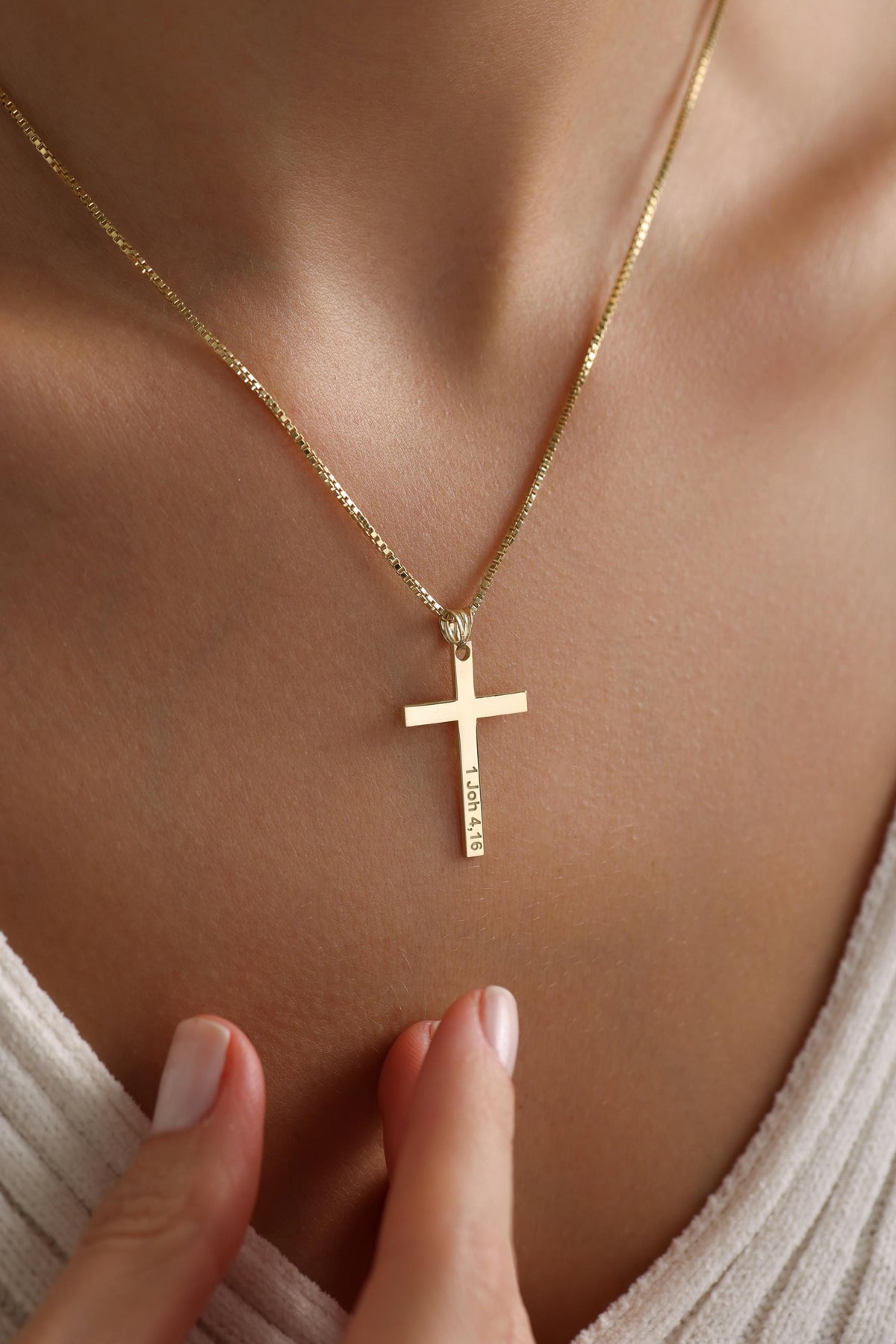 Dainty stone set cross necklace detail
