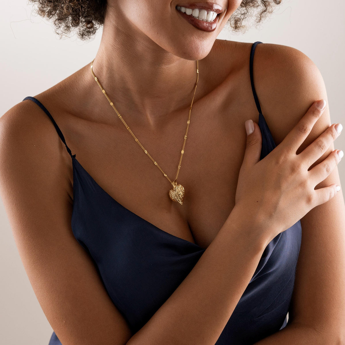 Statement heart necklace worn on the neck