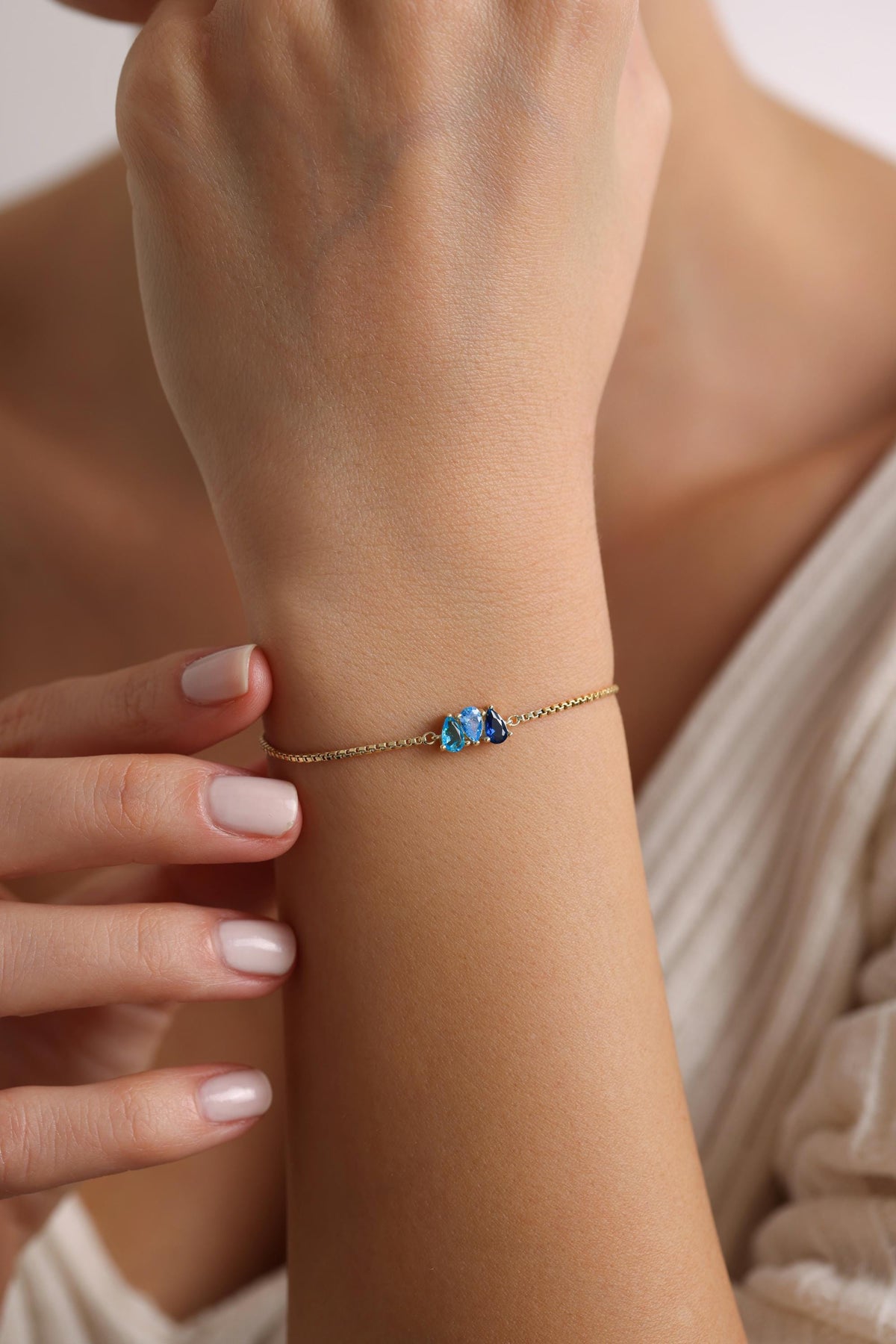 Dainty teardrop birthstone bracelet close up