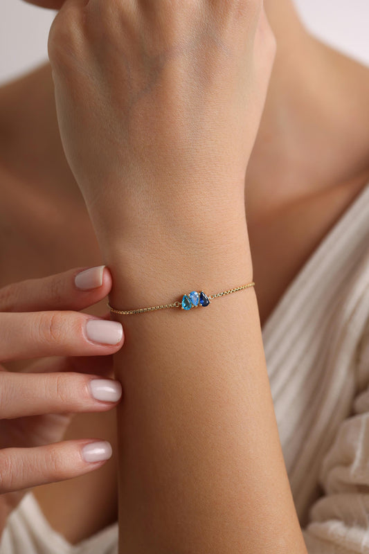 Dainty teardrop birthstone bracelet close up