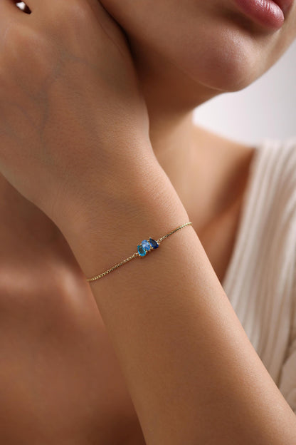 Personalized teardrop stone bracelet on the arm