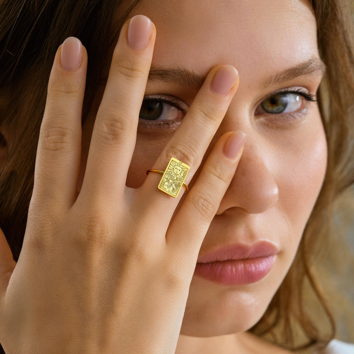 Tarot signet ring on hand