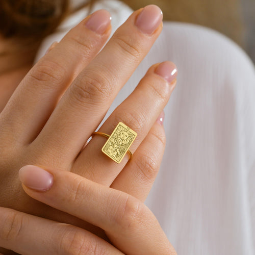 Tarot card signet ring worn on finger